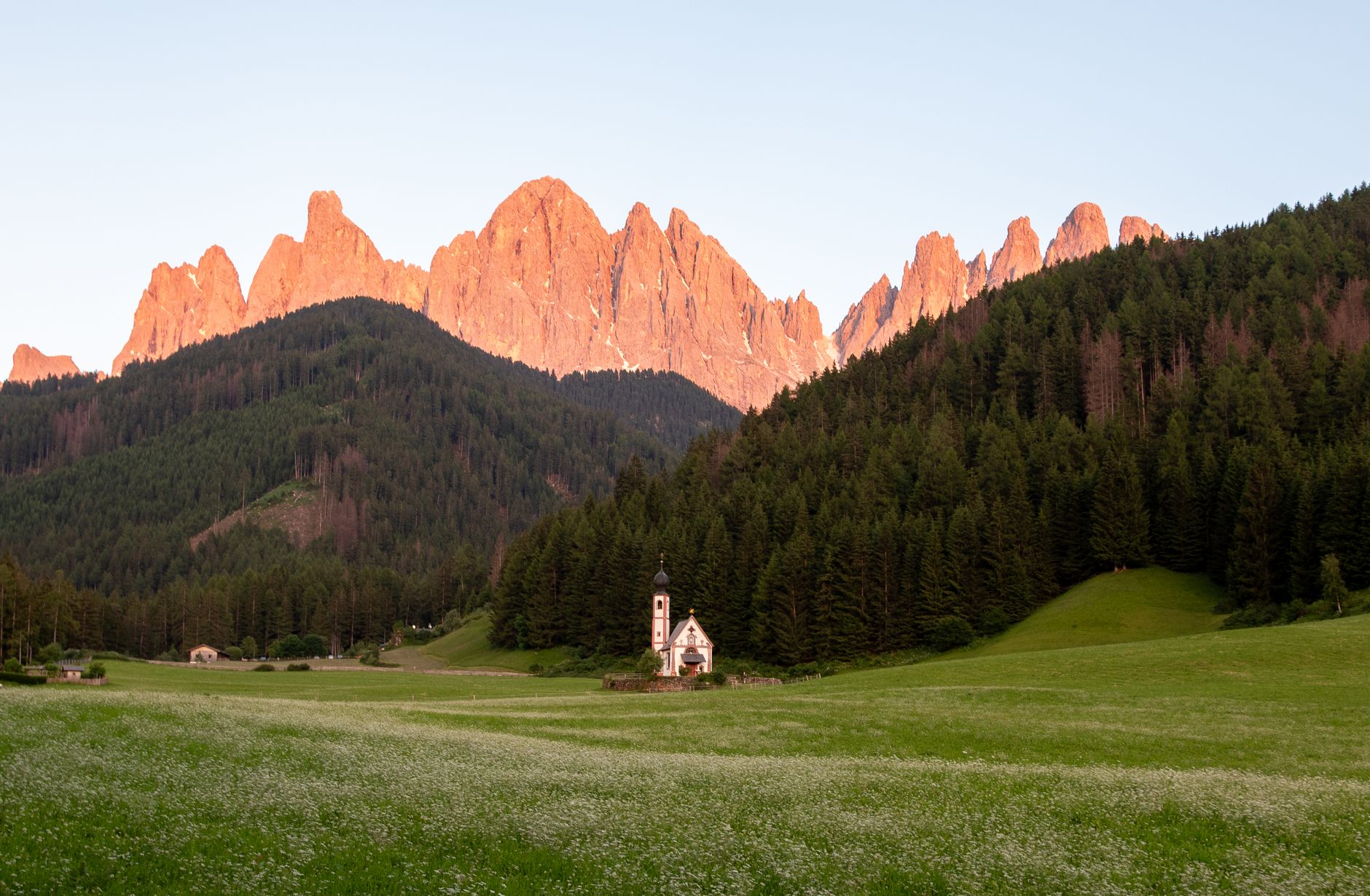 Dolomite mountain peaks in early morning mist