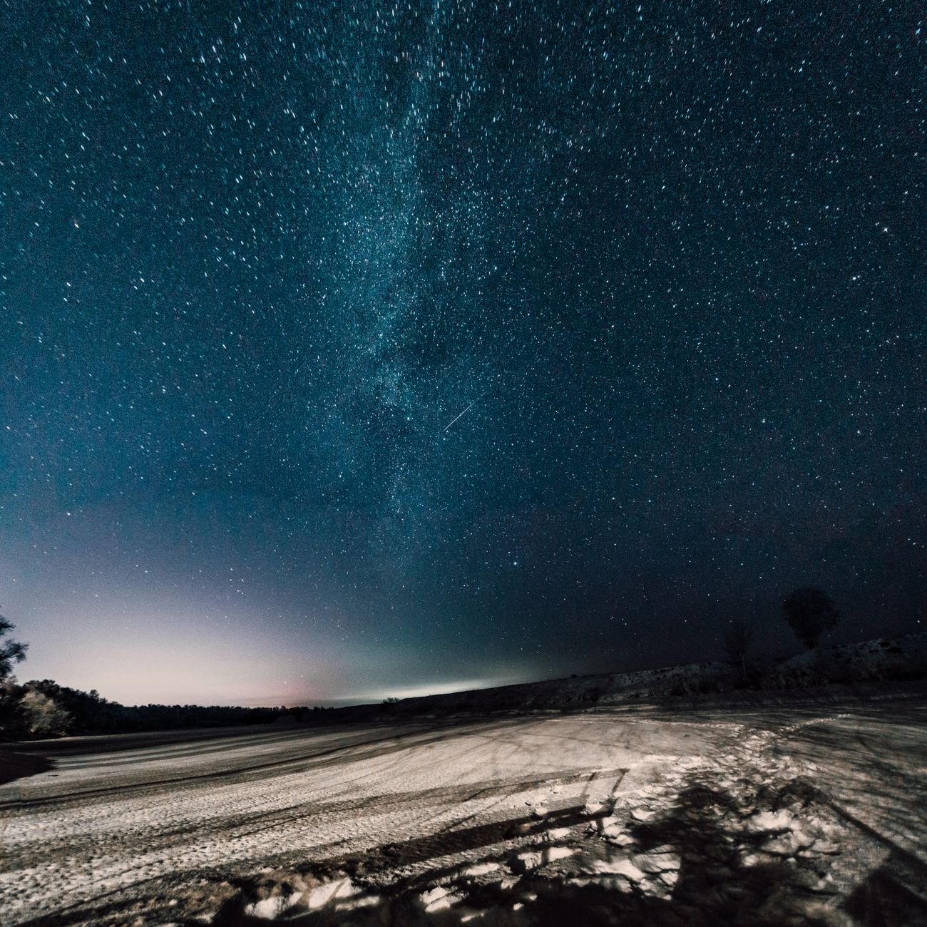 The Milky Way glowing brilliantly over Atacama desert rocks